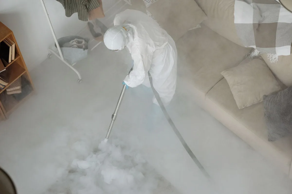 Biohazard cleanup technician in protective equipment, Orange, CT